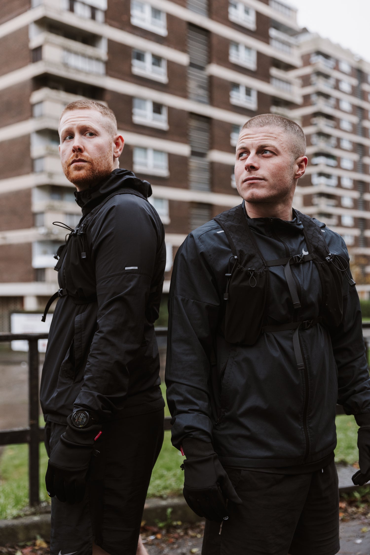 A Two urban runners in full winter gear 